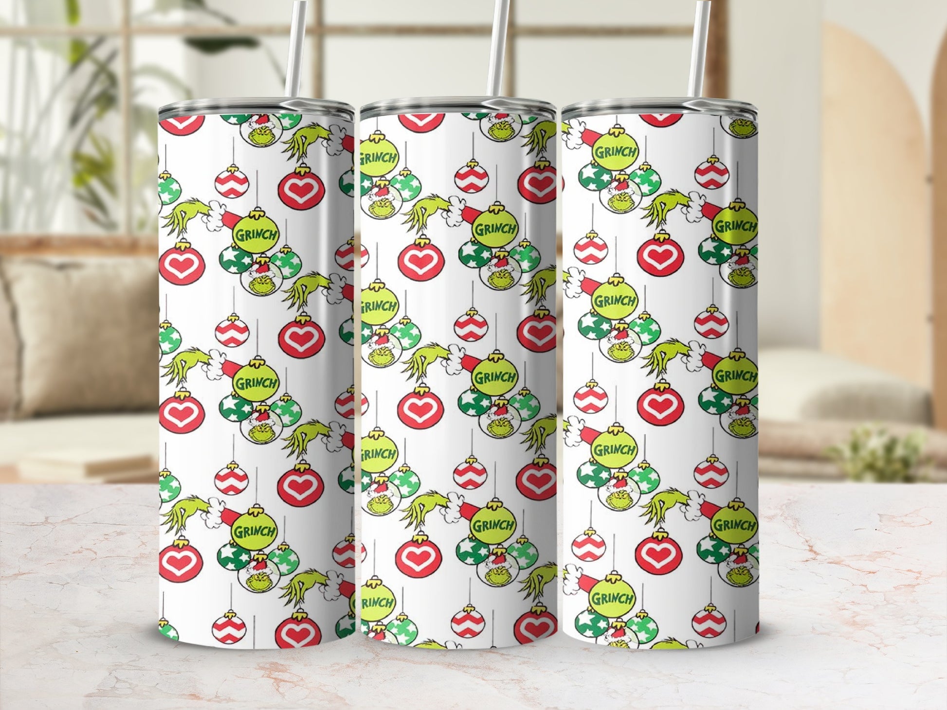 Grinch holiday ornaments pattern on a white tumbler with straws.