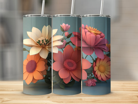 Three tumblers with colorful floral designs displayed on a wooden surface.