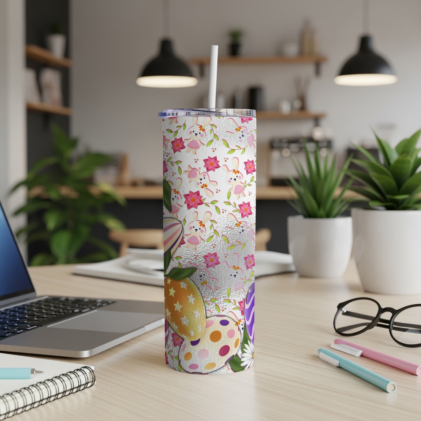 Easter tumbler with bunnies, eggs, and floral pattern.
