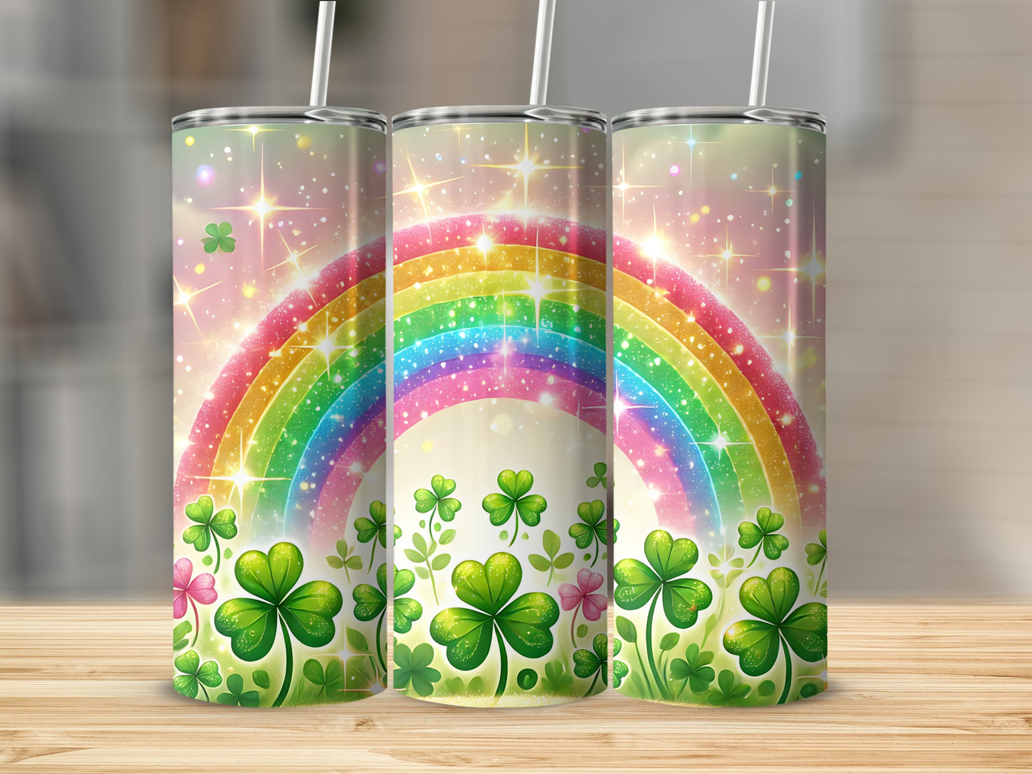 Three tumblers with rainbow and shamrock design.