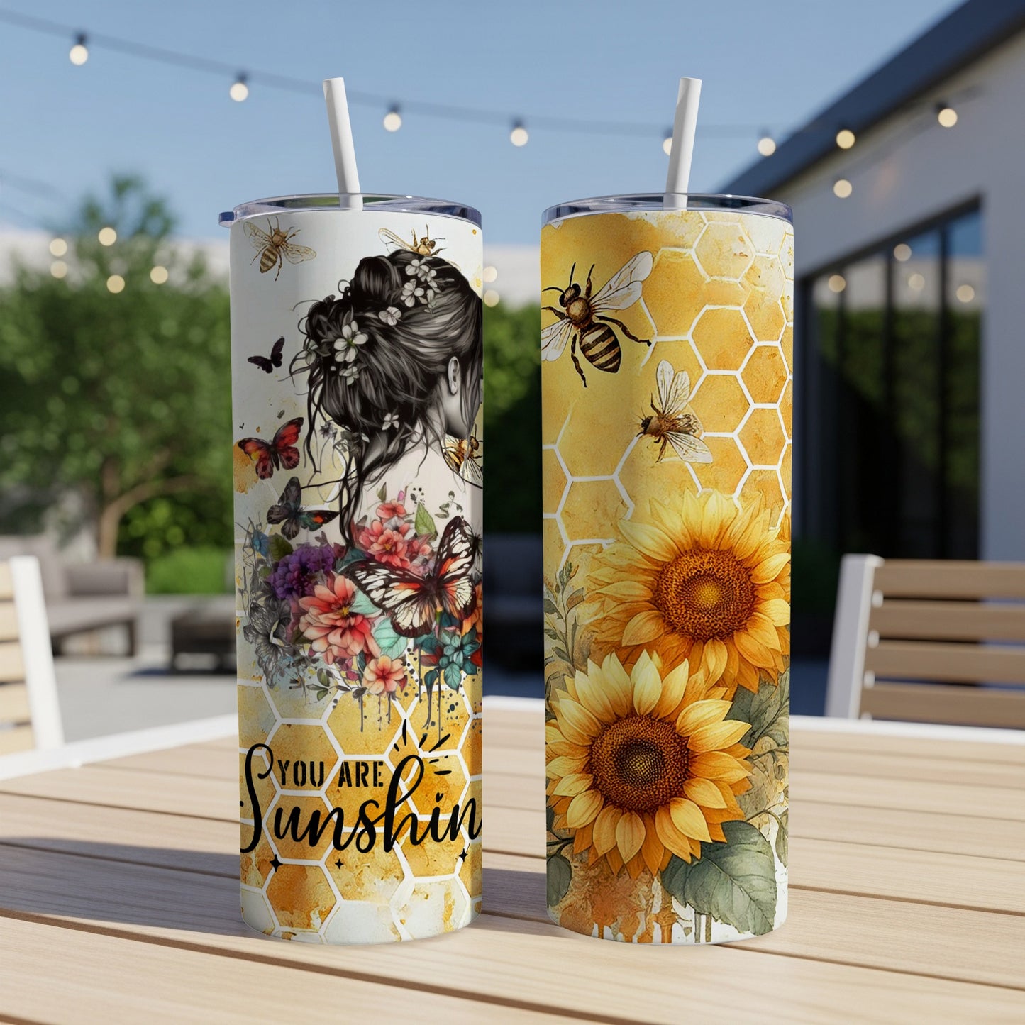 Two tumblers with bee and sunflower designs, one reads "You are Sunshine".