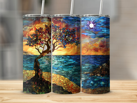 Three tumblers with stained-glass style art of a tree, ocean, and sun.