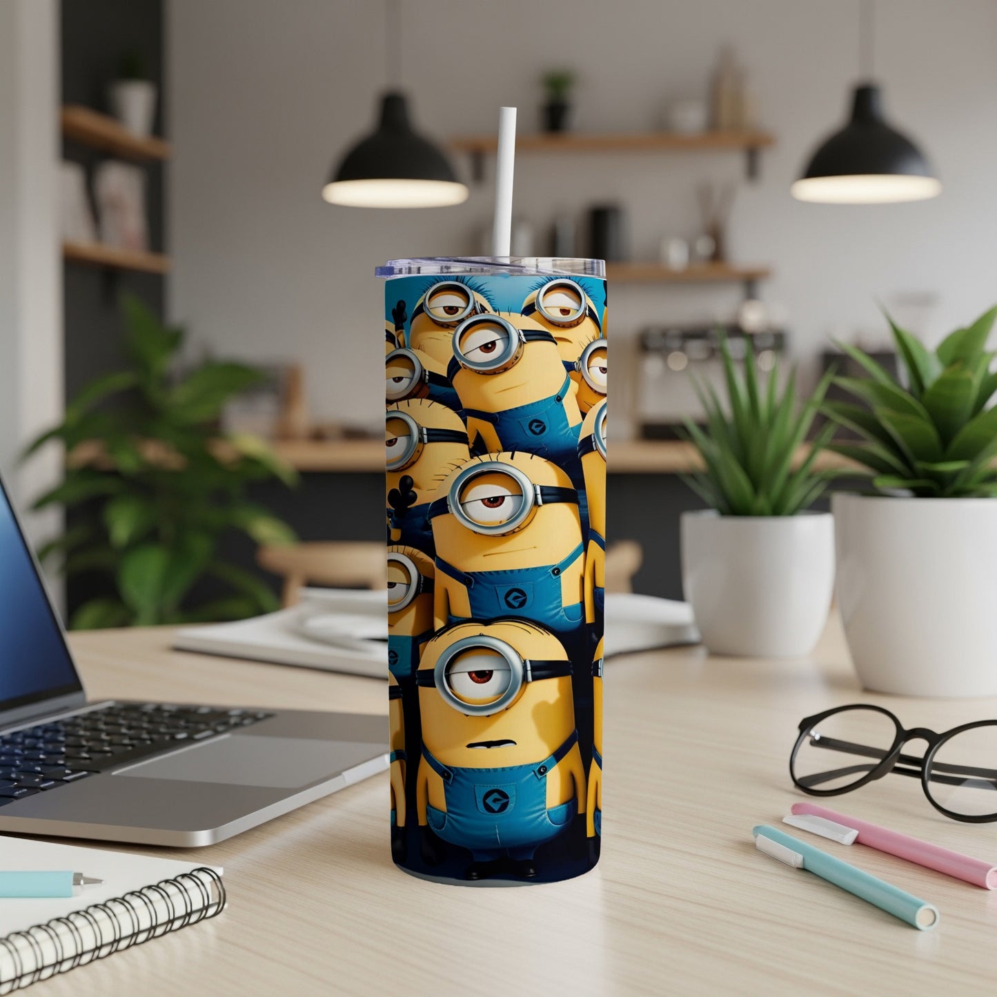 Tall tumbler featuring a pattern of cartoon Minion characters on a blue background.