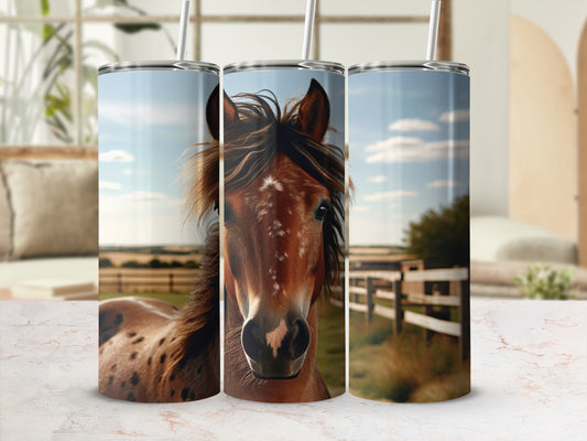 Close-up portrait of a horse's face on three stacked tumblers.