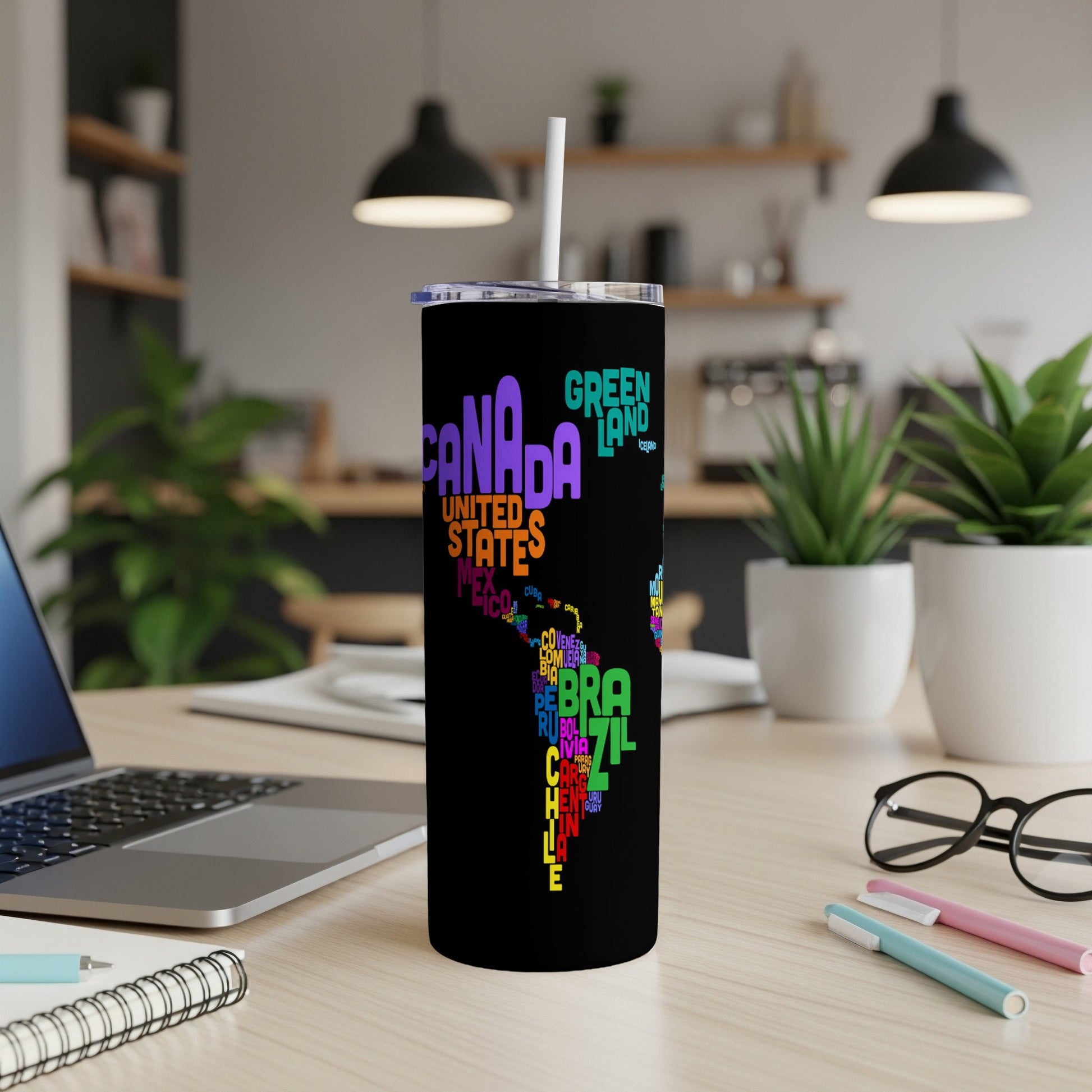 Black tumbler with colorful word art map of North and South America.