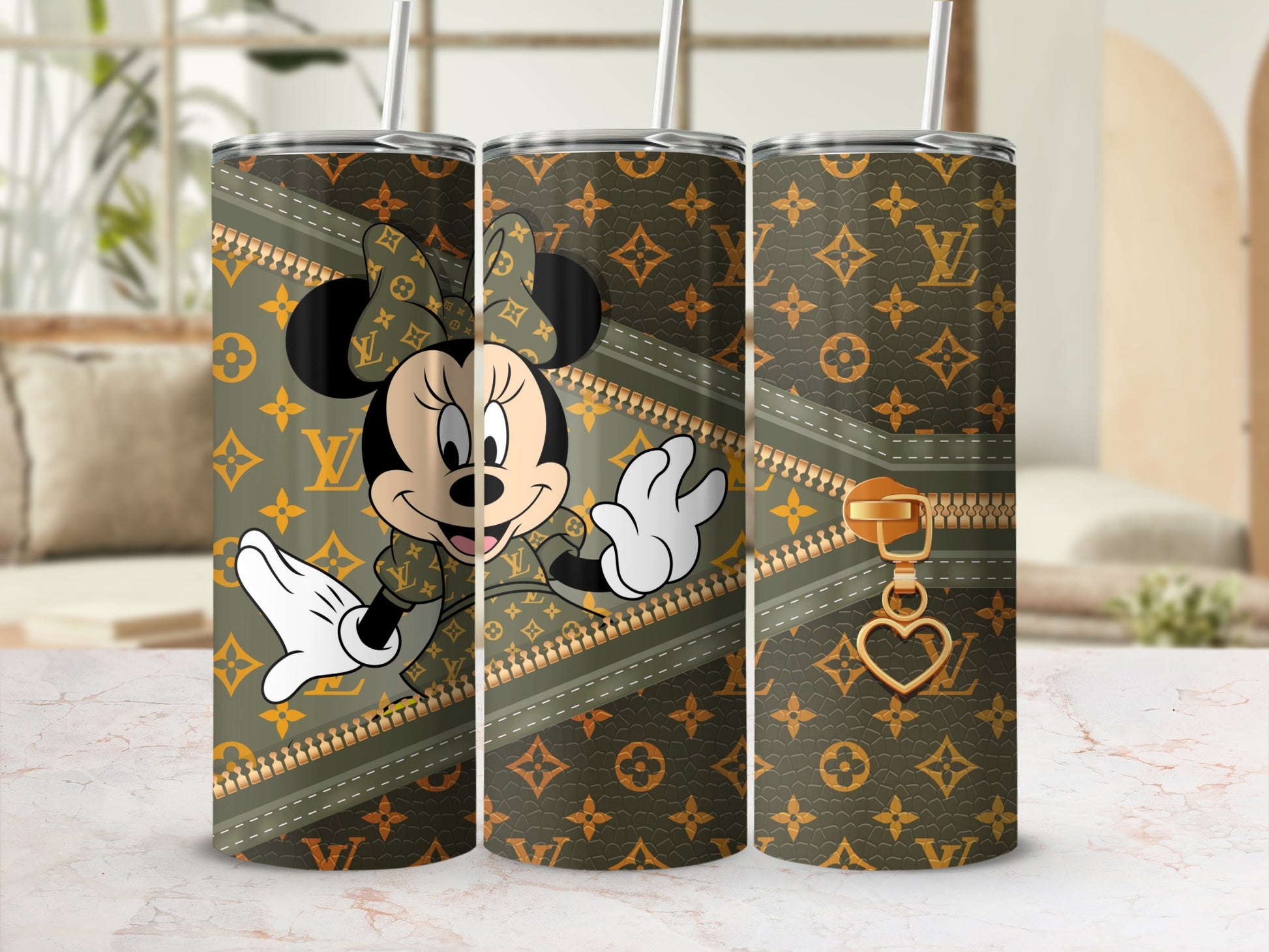 Minnie Mouse on a brown and gold monogrammed tumbler with a zipper design.