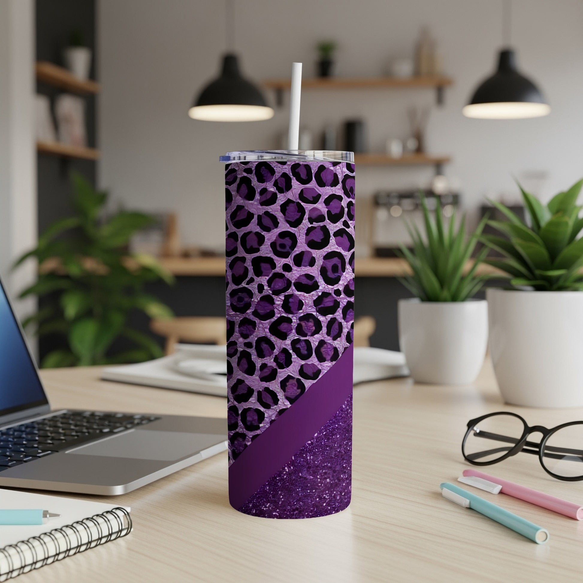 Purple leopard print tumbler with glitter accent and straw.