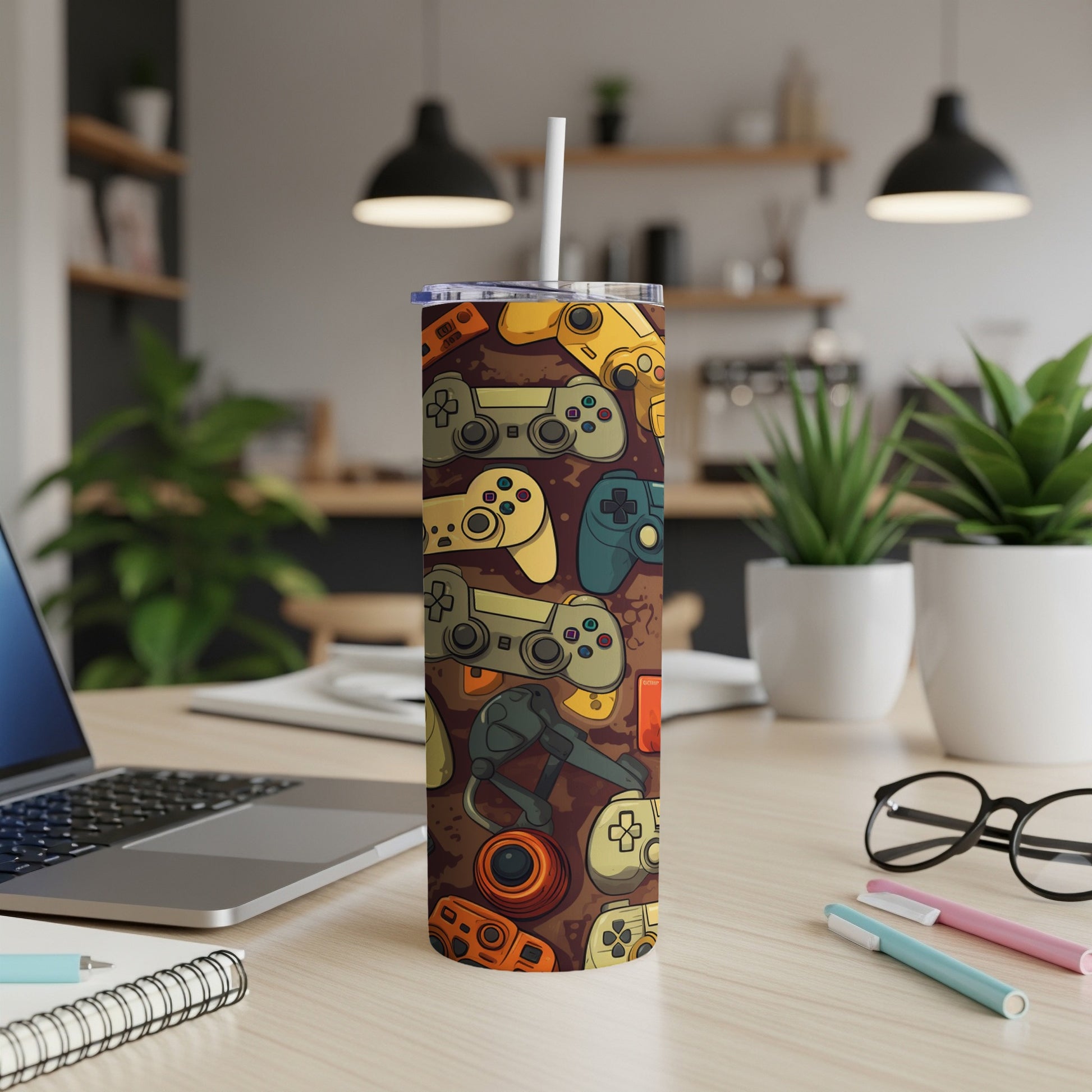 Tumbler with a collage of colorful video game controllers and accessories.