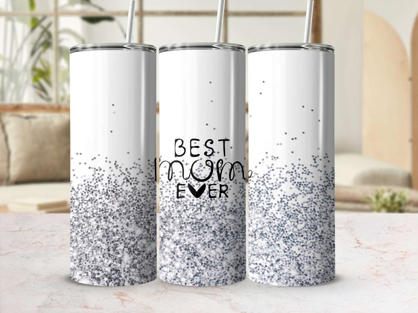 White tumbler with "Best Mom Ever" text and silver glitter.