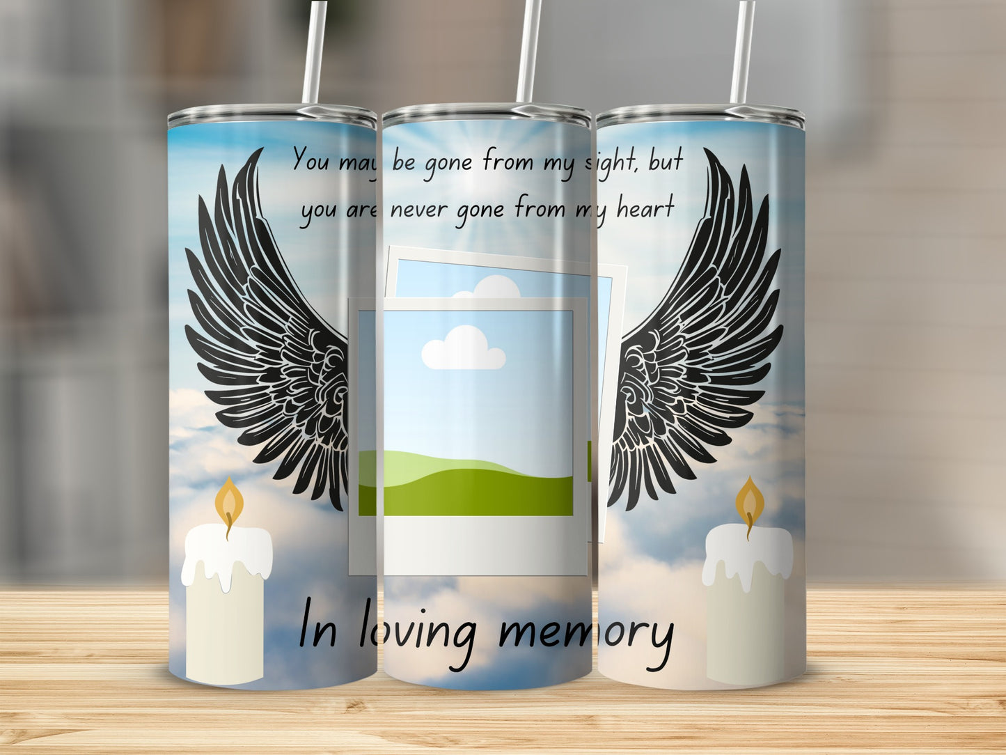 Tumbler with angel wings, candle, and text "In loving memory".