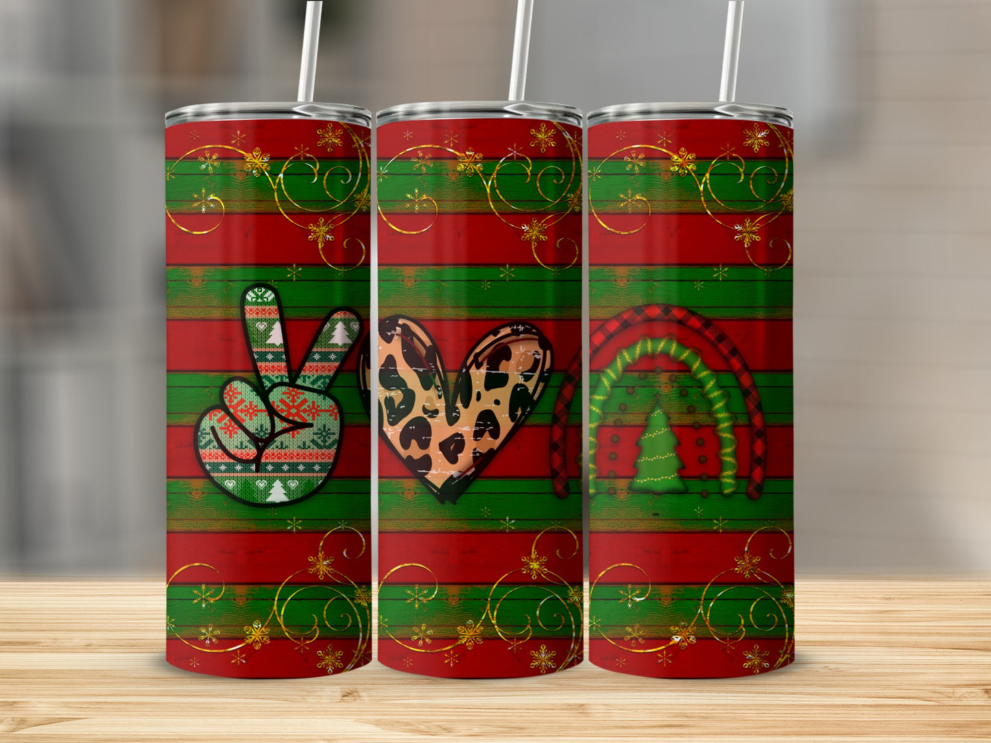 Three striped tumblers with Christmas designs: peace sign, leopard heart, and rainbow tree.