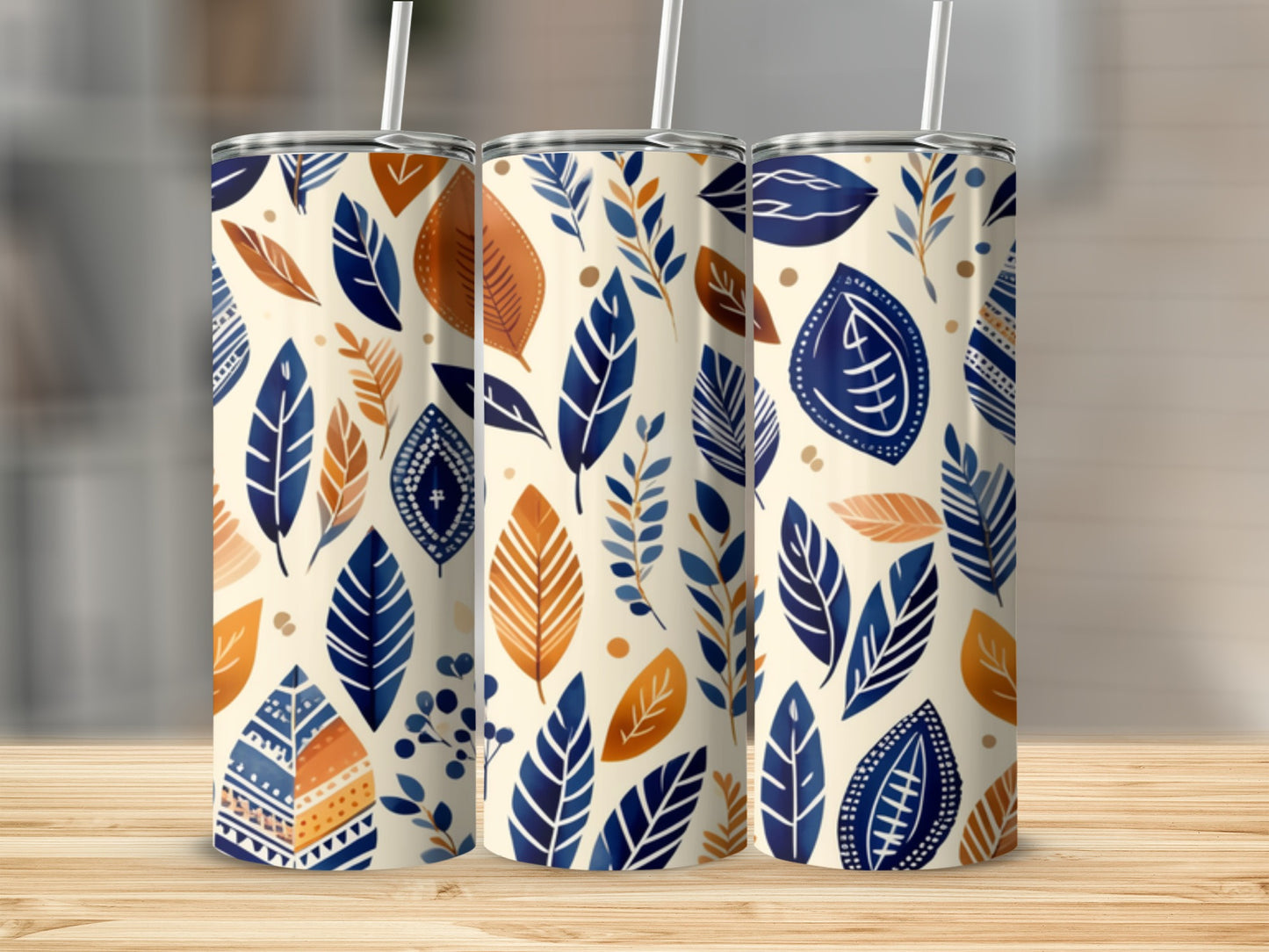 Three tumblers with blue and orange leaf pattern.