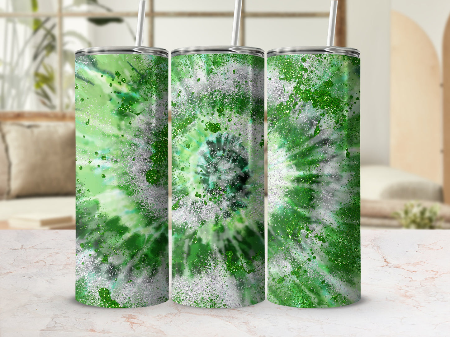 Three green tie-dye tumblers with white and silver glitter accents.