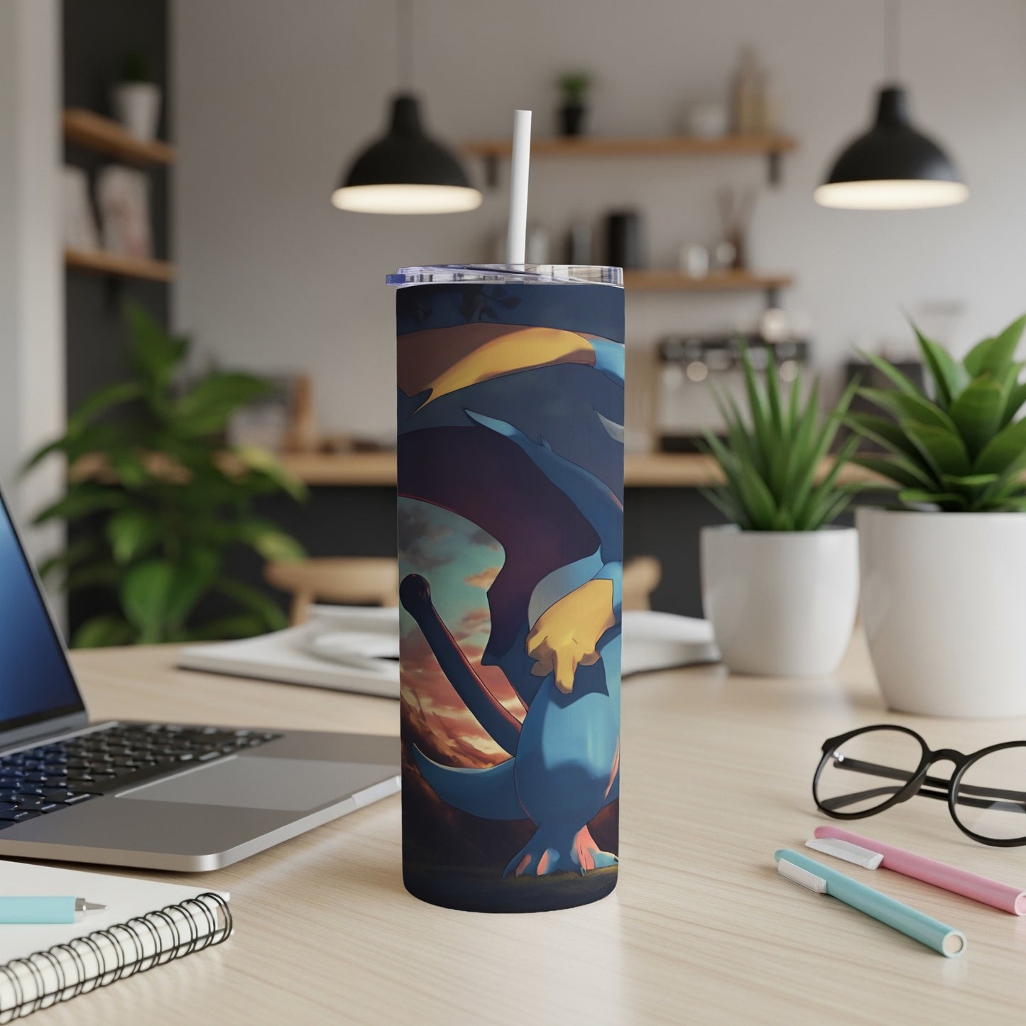 Blue dragon character on a cylindrical tumbler with a straw.