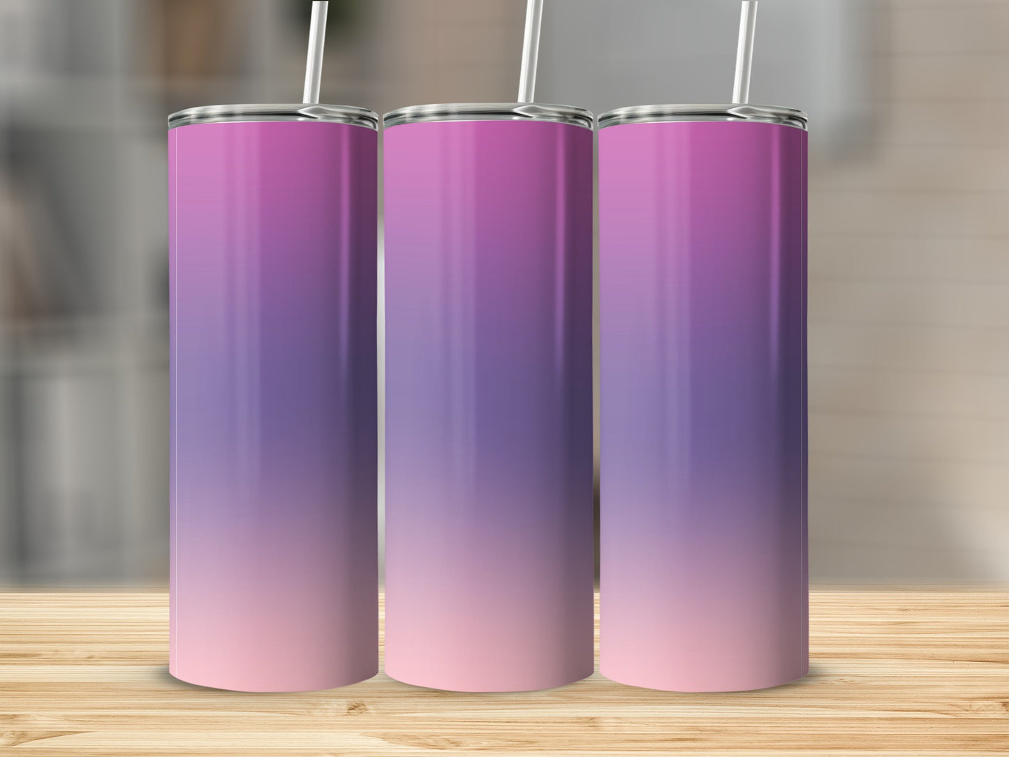 Three tall, stainless steel tumblers with a pink and purple ombre gradient.