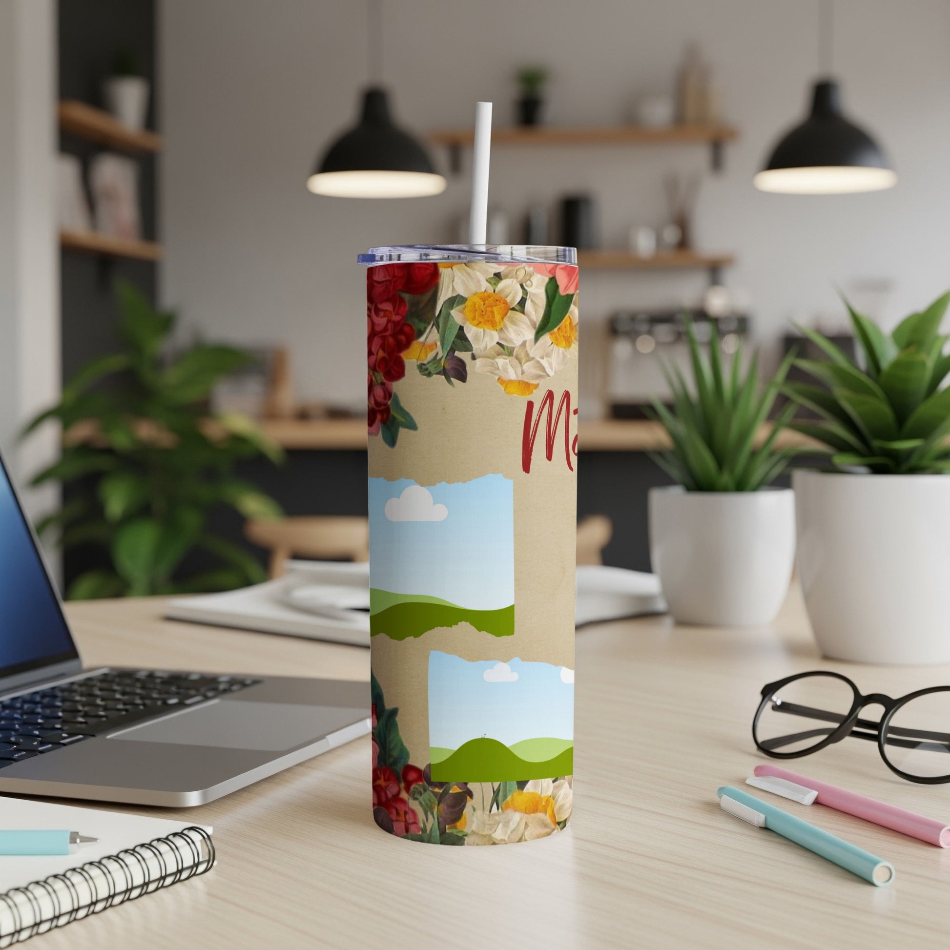 Floral tumbler with two empty photo frames and "M" text on kraft paper.