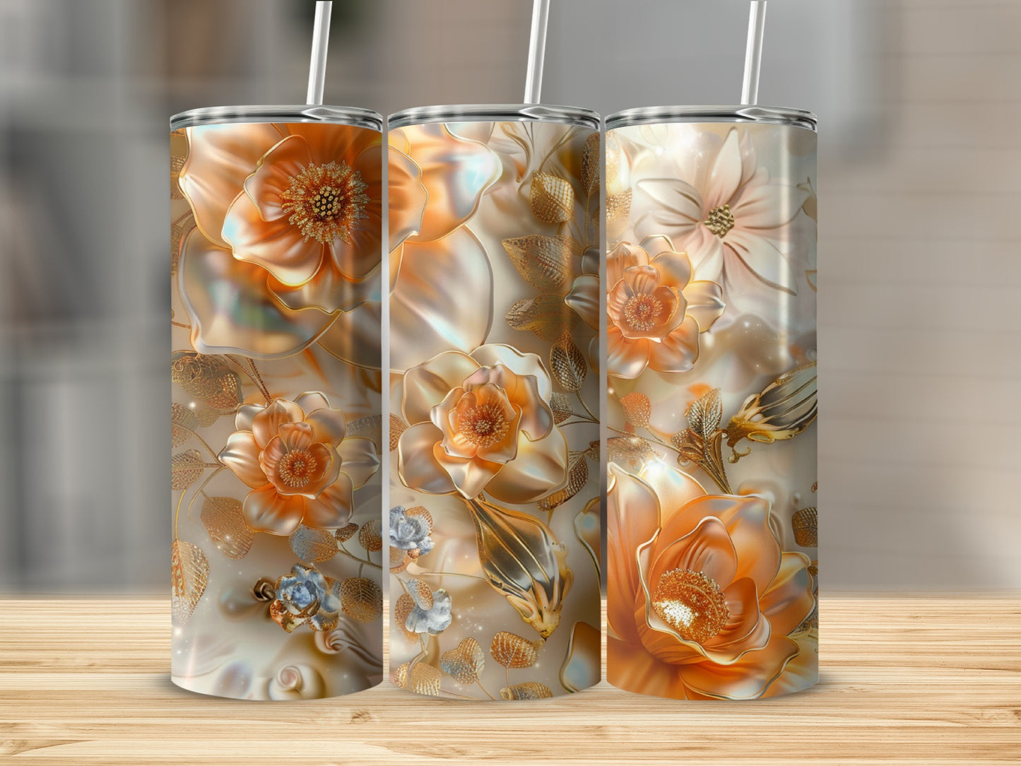 Three floral tumblers with orange, gold, and blue floral designs.