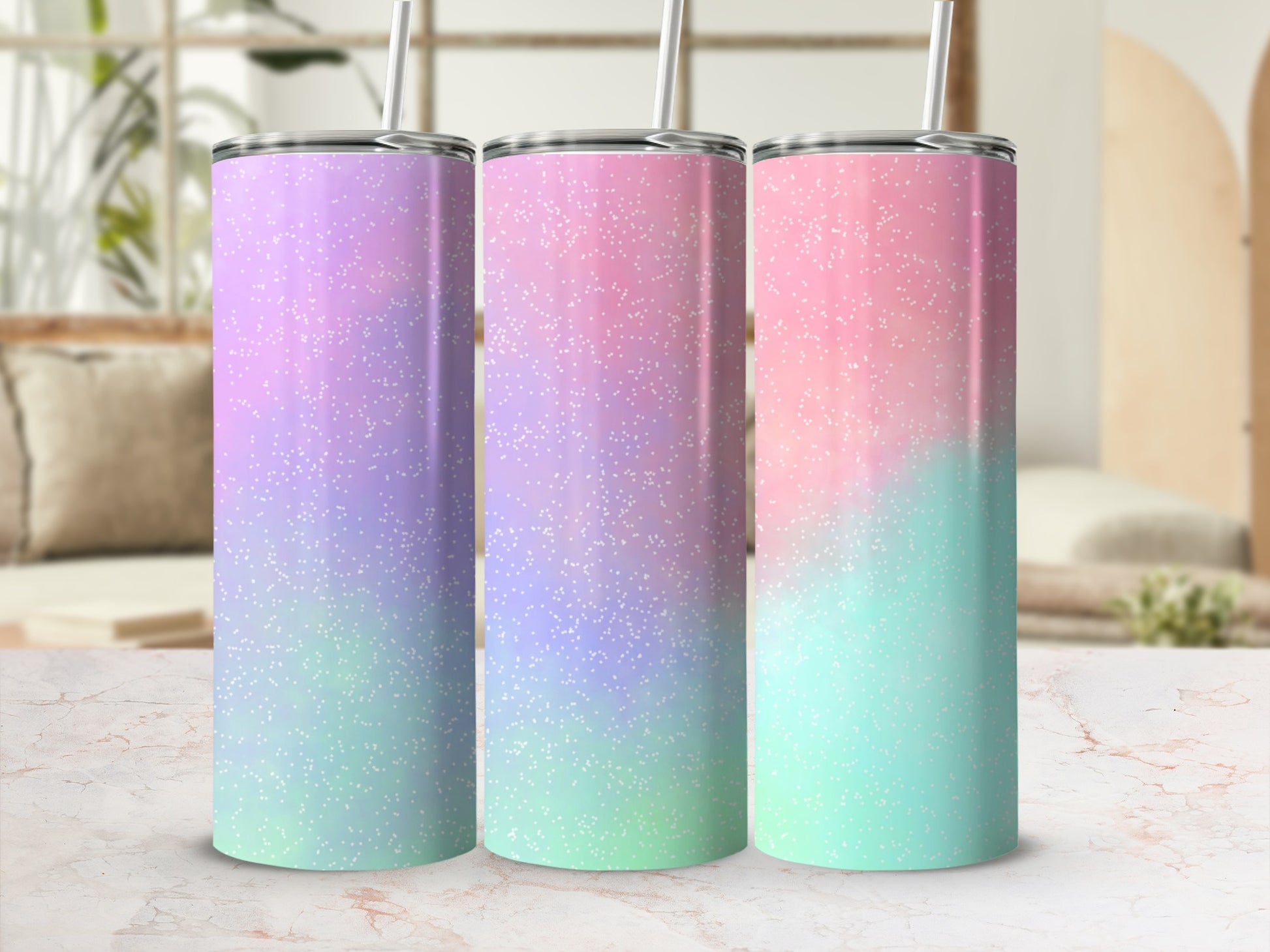 Three tumblers with purple, pink, and teal pastel ombre glitter designs.