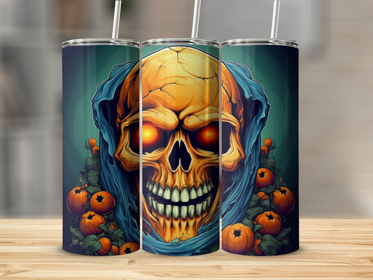 Three tumblers with a Halloween design of a skull with glowing eyes, draped in blue, surrounded by pumpkins.