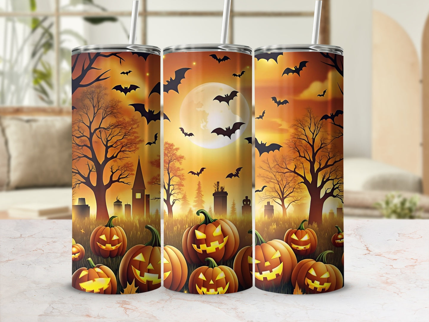 Halloween tumblers with carved pumpkins, bats, and a spooky graveyard scene.