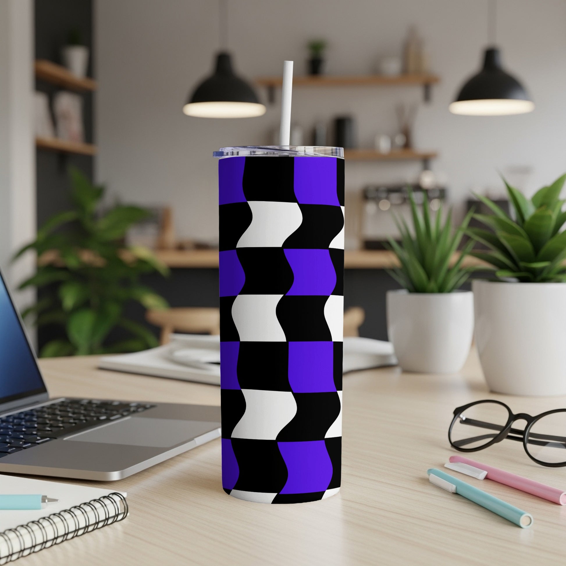 Purple and black wavy geometric pattern on a tumbler with a straw.