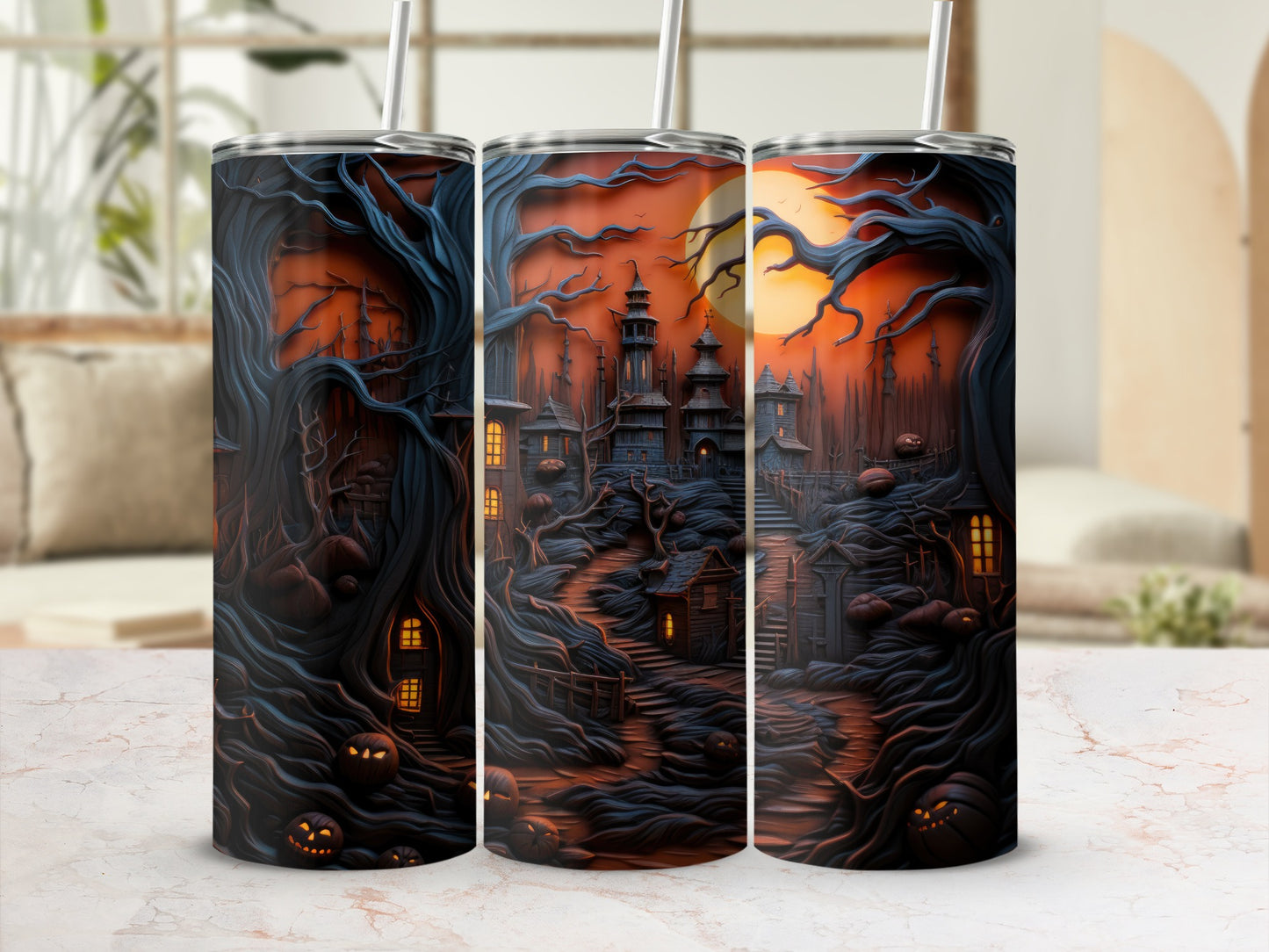 Three tumblers with a spooky haunted forest and village design under an orange moon.