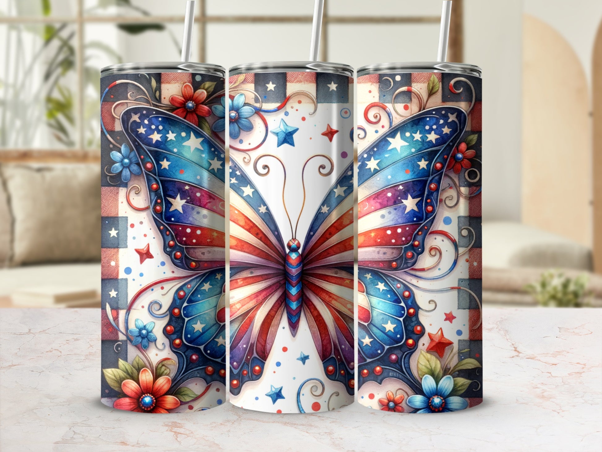 Patriotic butterfly and floral pattern on three tumblers with straws.
