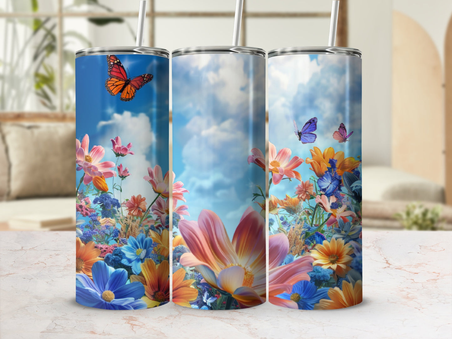 Three floral tumblers with butterflies and a sky background.