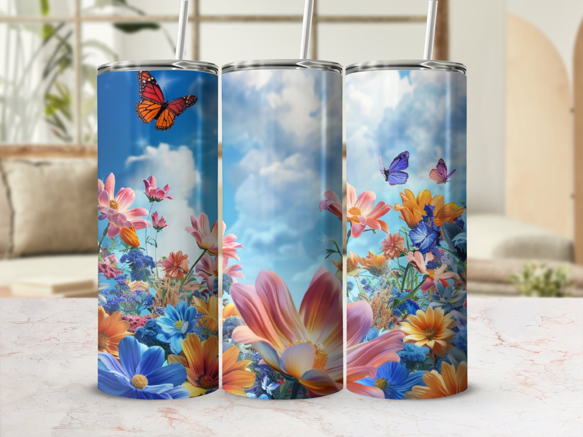 Three floral tumblers with butterflies and a sky background.