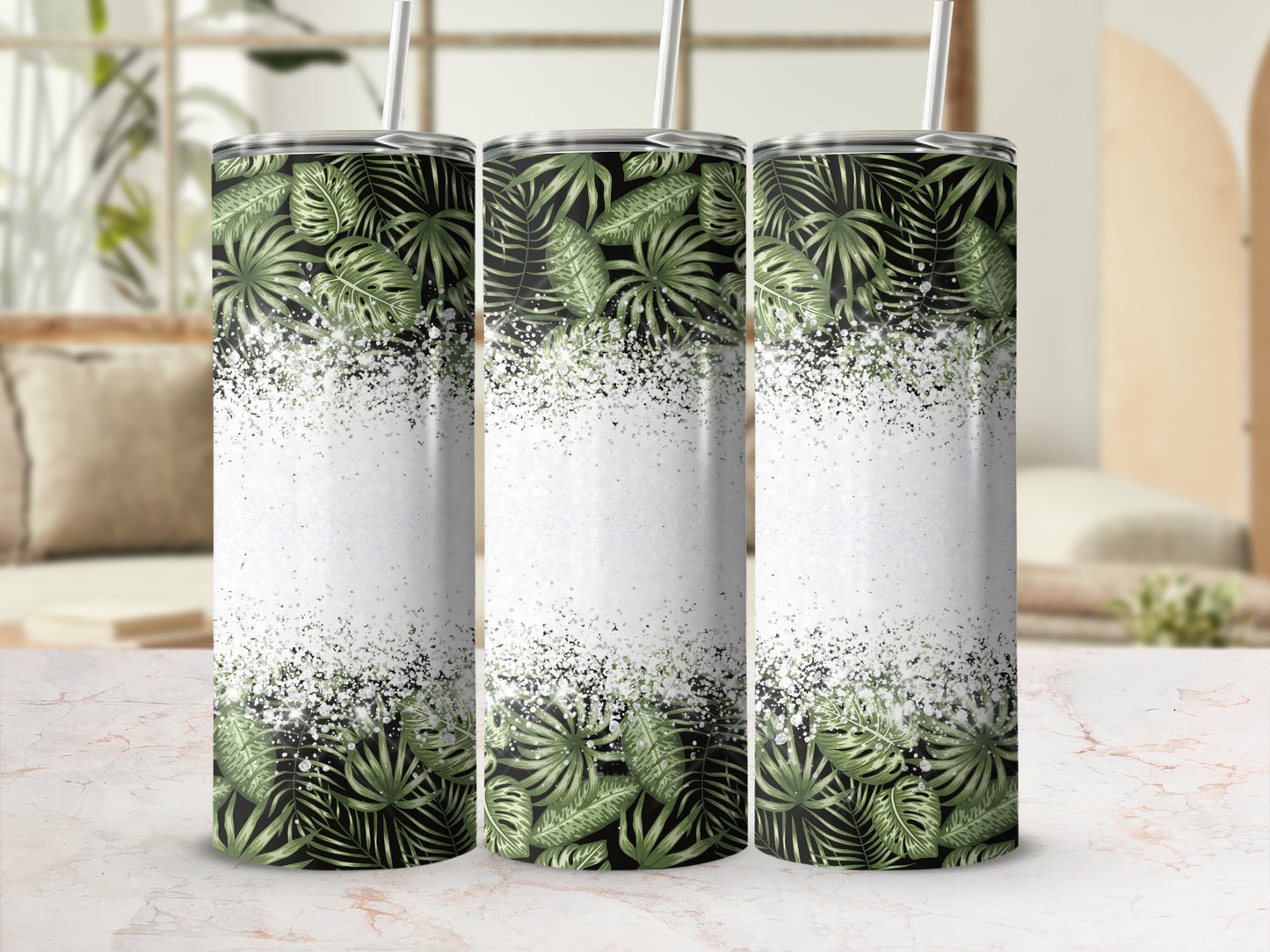 Three tumblers with a green palm leaf design and white glitter speckled background.