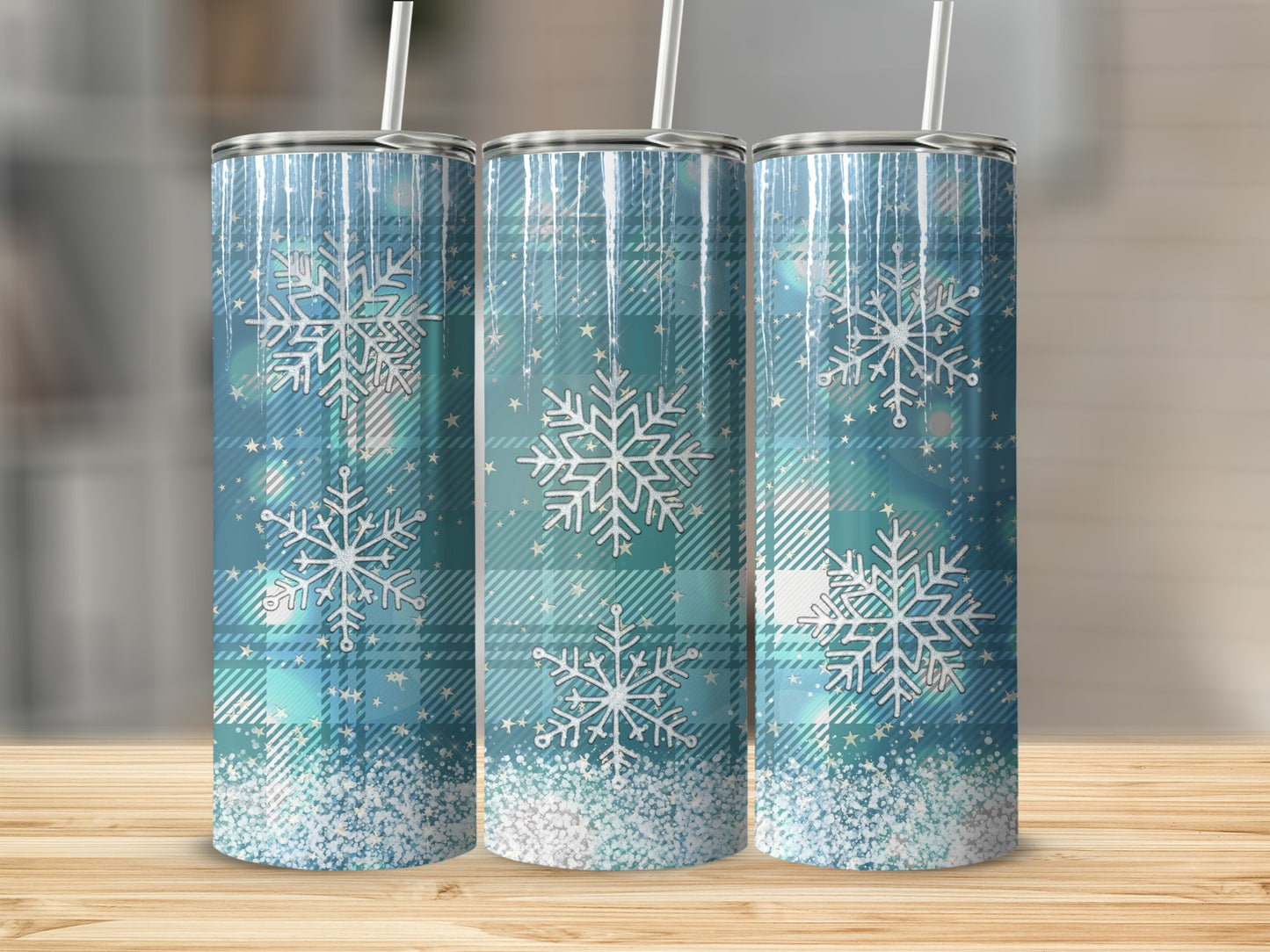 Three blue plaid tumblers with snowflakes and glitter accents.