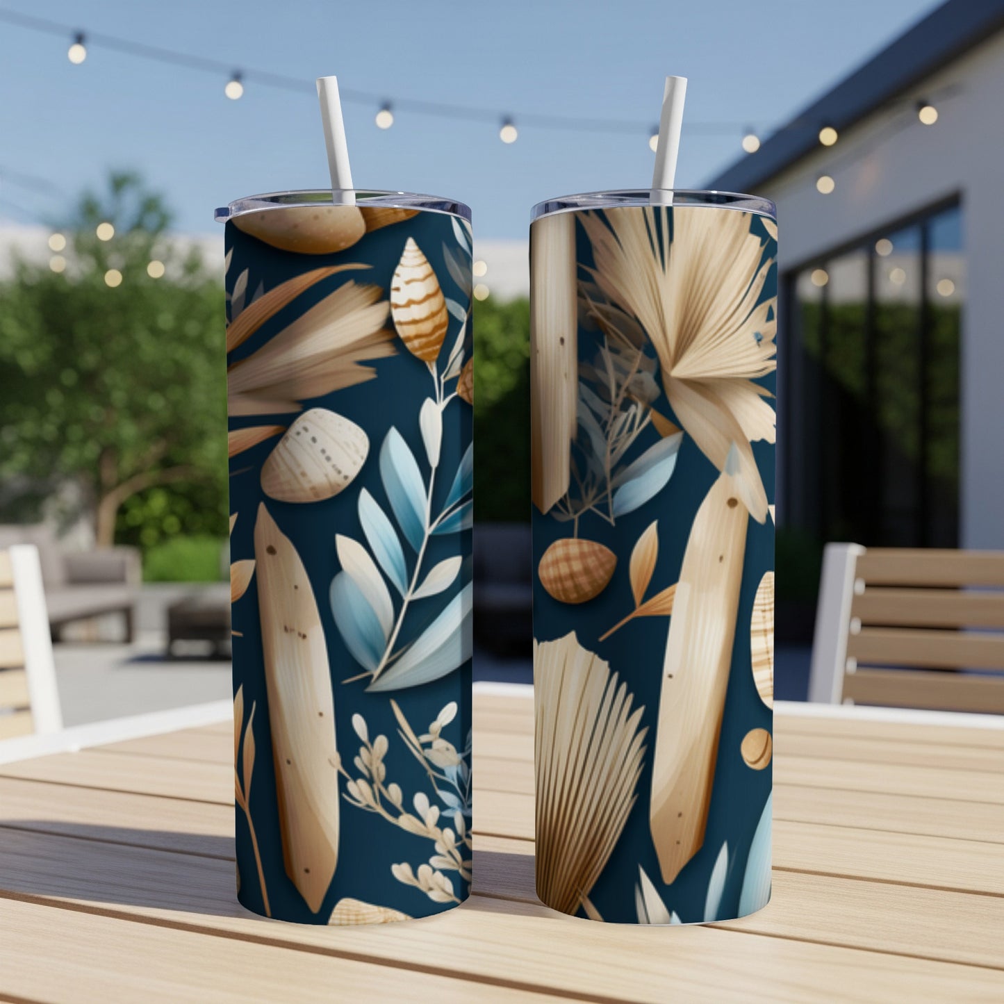 Two tumblers with a dark blue background and a tropical leaf and shell pattern.
