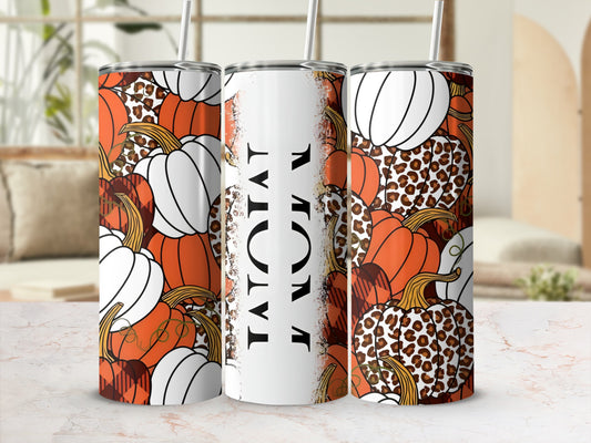 Tumbler with pumpkins, leopard print, and plaid patterns.