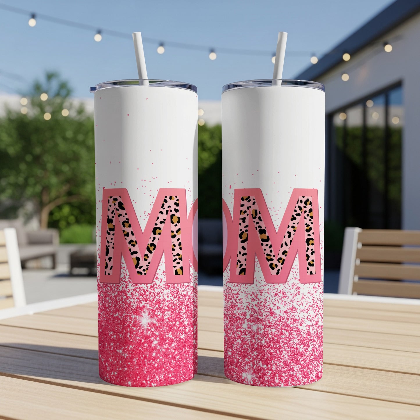 Two white tumblers with pink glitter and leopard print "MOM" design.
