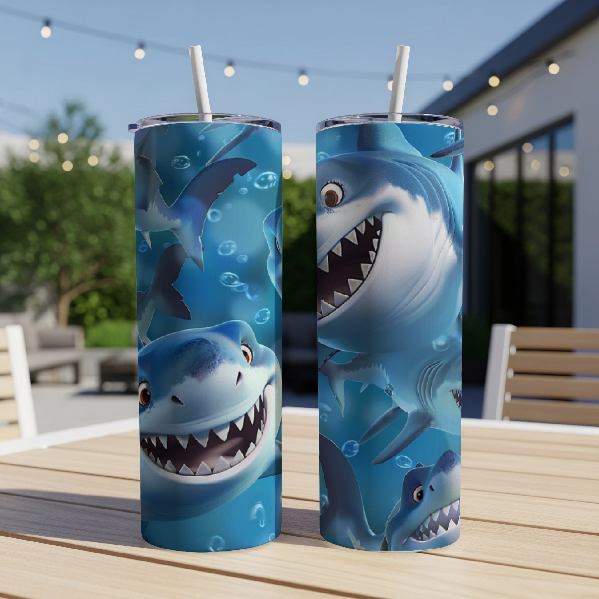 Two cartoon shark tumblers with smiling shark faces and bubbles.