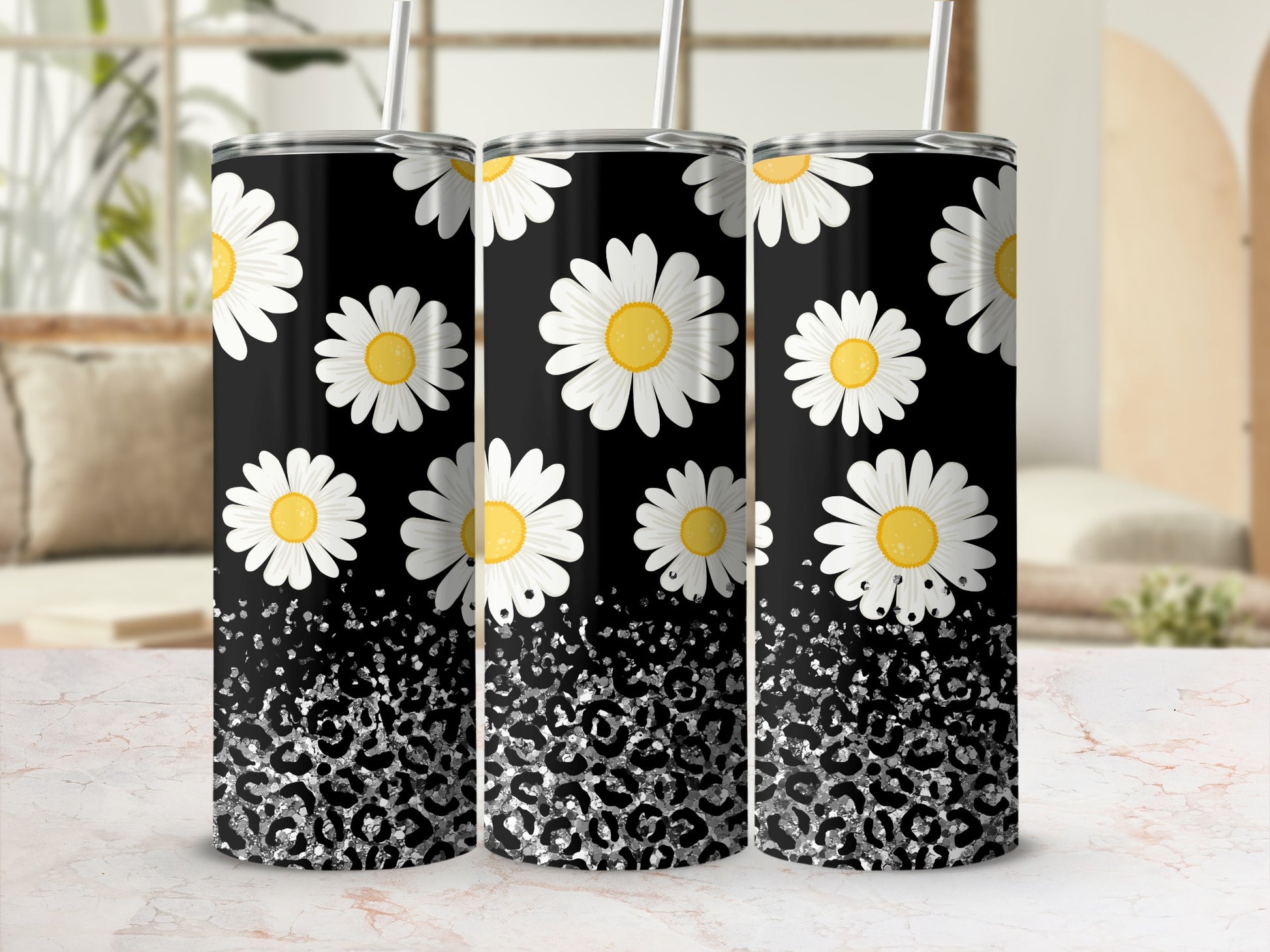 Black tumbler with white daisies and silver leopard print glitter.