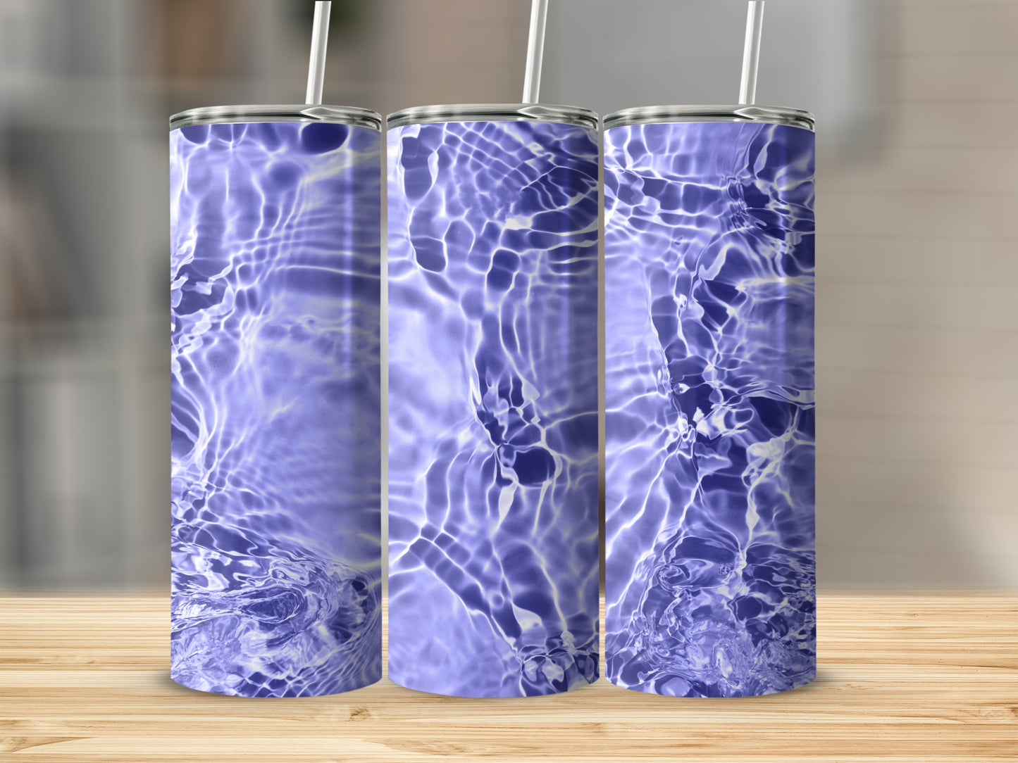 Three tall, slender tumblers with rippling water pattern.