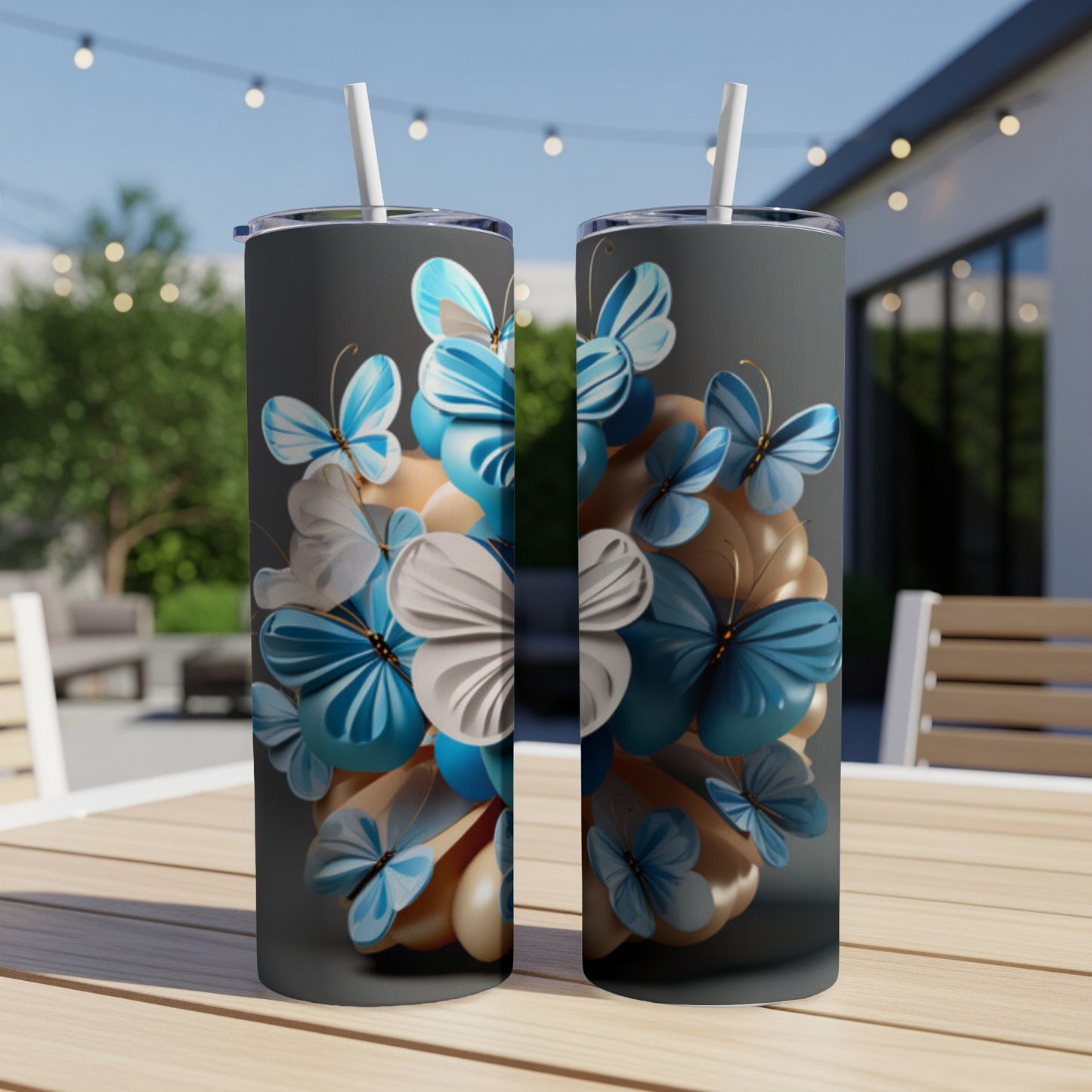 Two tumblers with blue, white, and beige butterflies on a gray background.