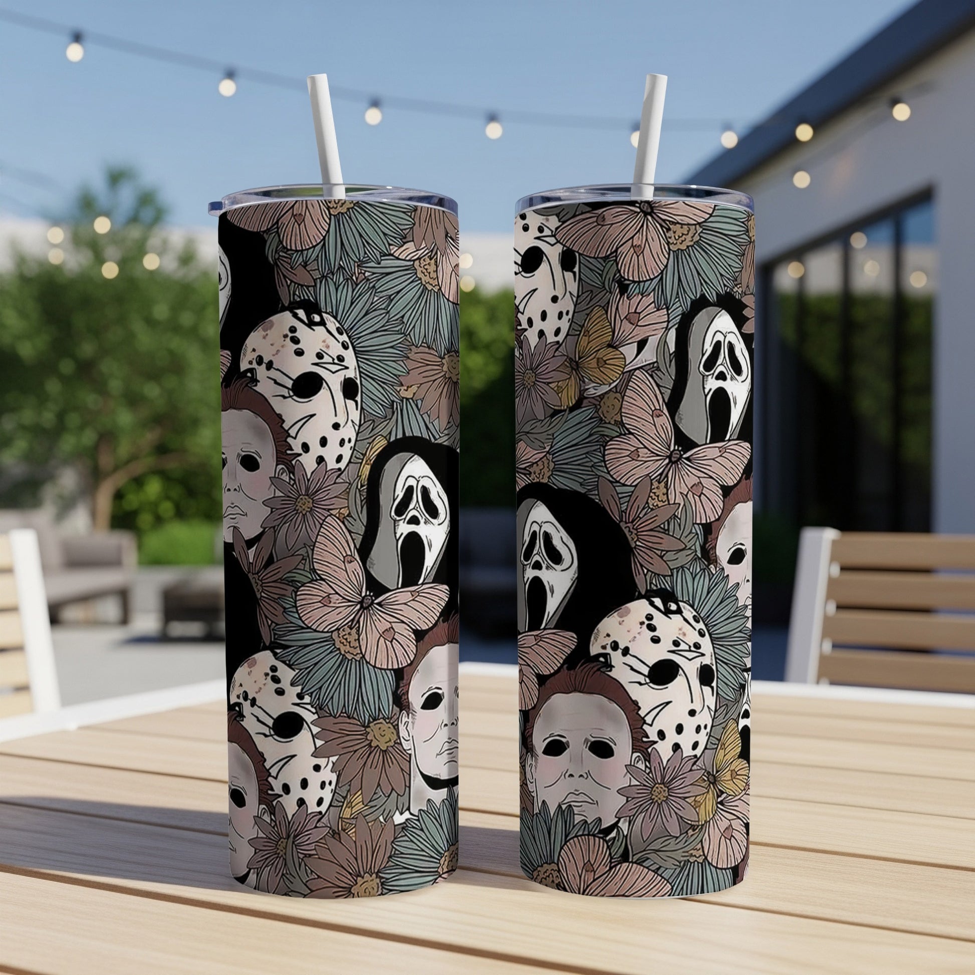 Two tumblers with horror movie masks and floral patterns.