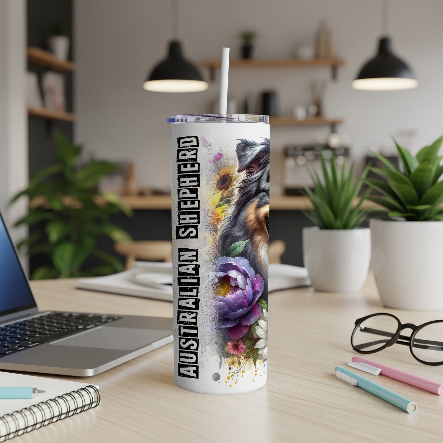 Tumbler with Australian Shepherd dog, floral design, and white straw.