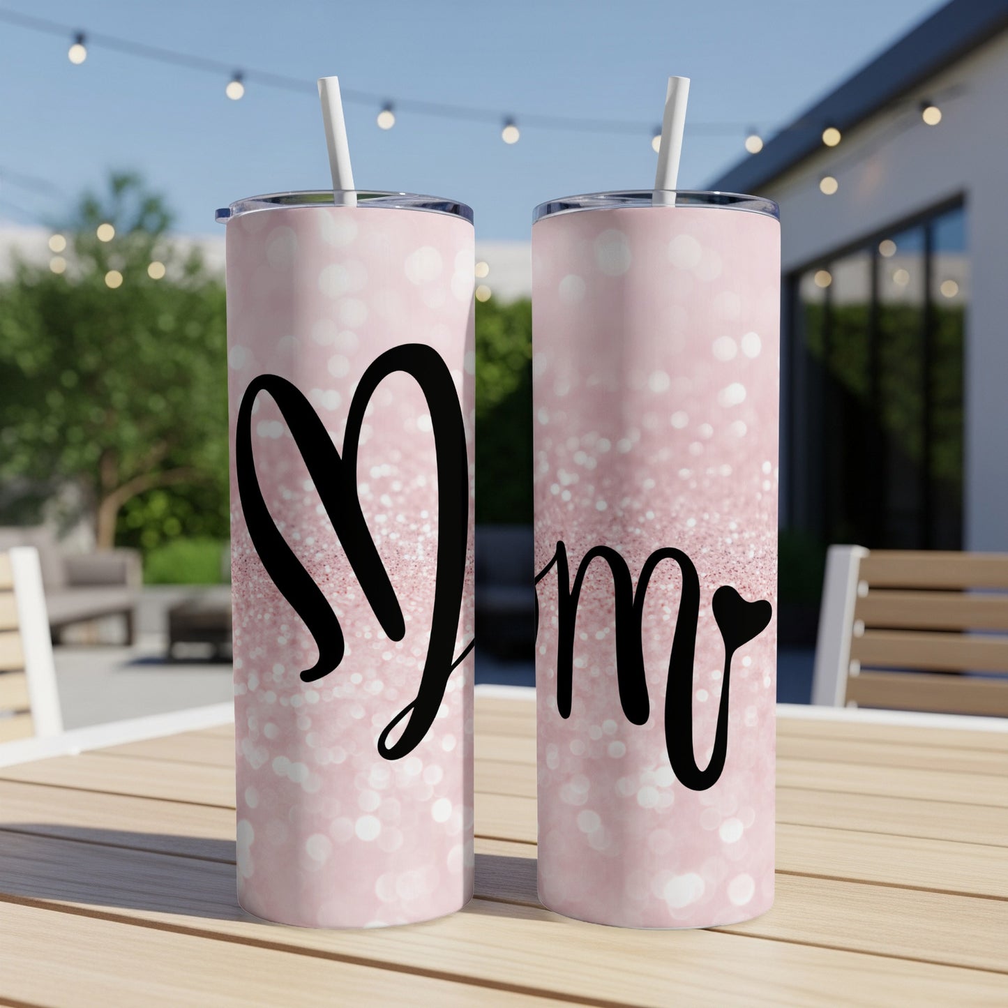 Two pink glitter tumblers with "Mr" and "Mrs" text and a heart graphic.