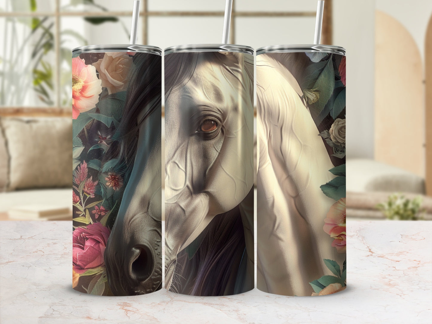 White horse head and flowers adorn three tumblers on a marble countertop.