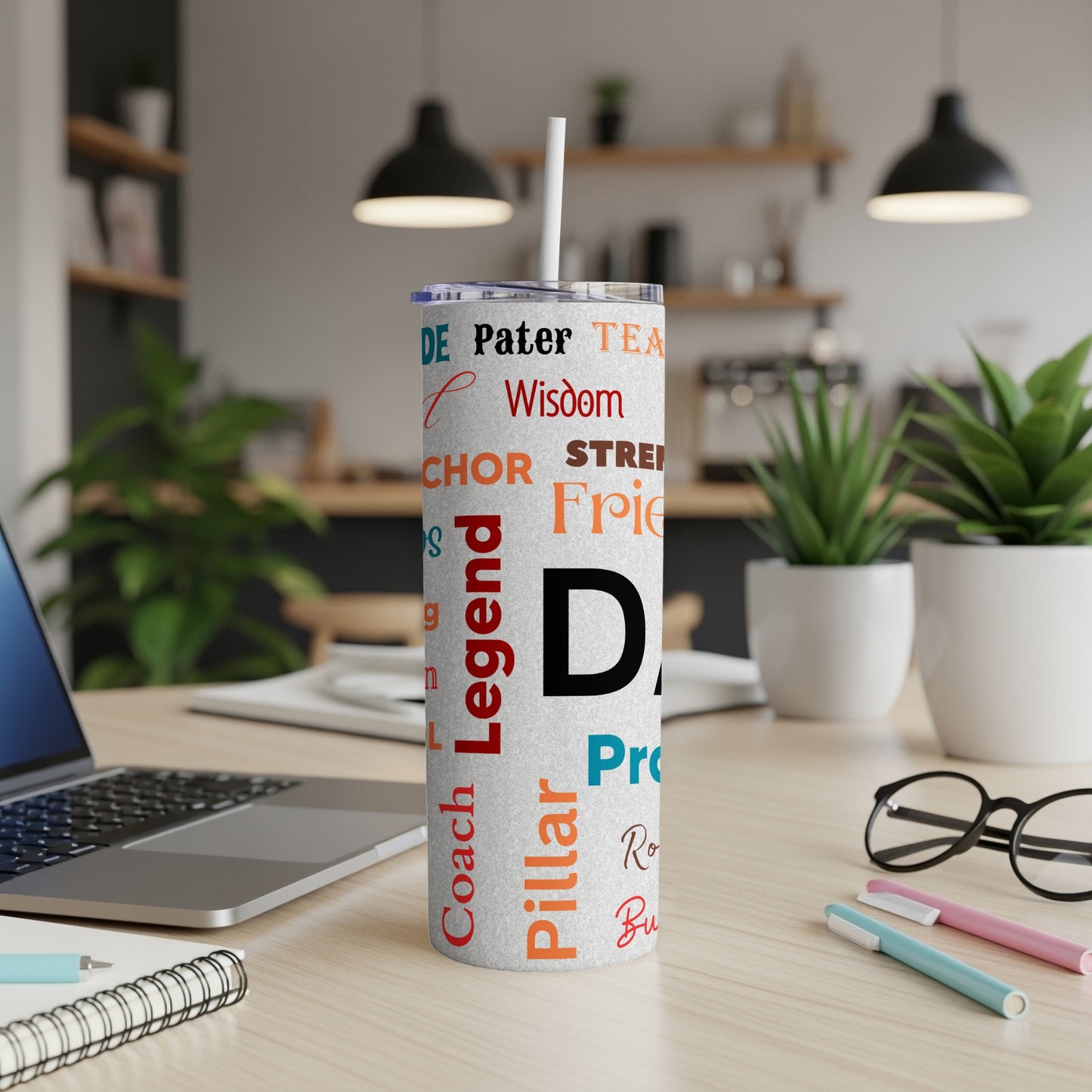 Tumbler with "Dad" and fatherhood-related words in various colors.