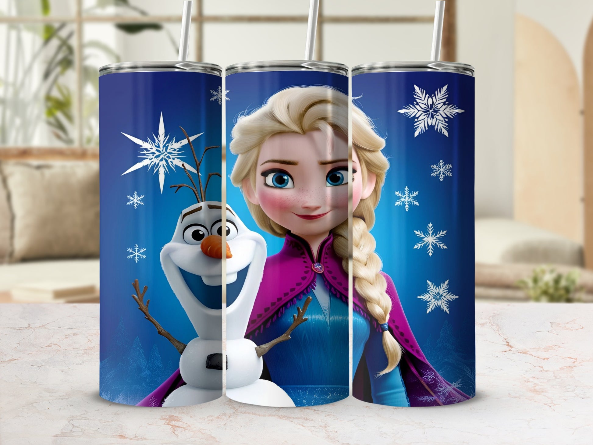 Olaf and Elsa from Frozen on a blue tumbler with snowflakes.