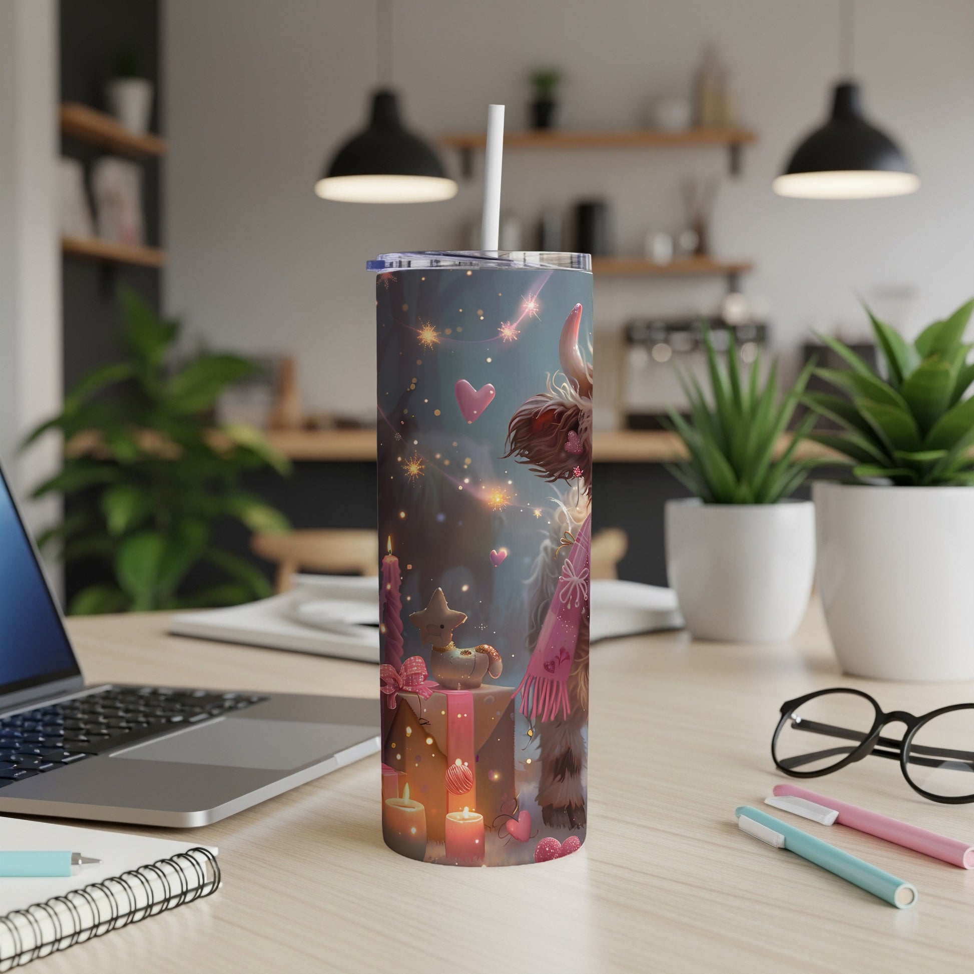 Cow tumbler with festive holiday design and pink scarf.