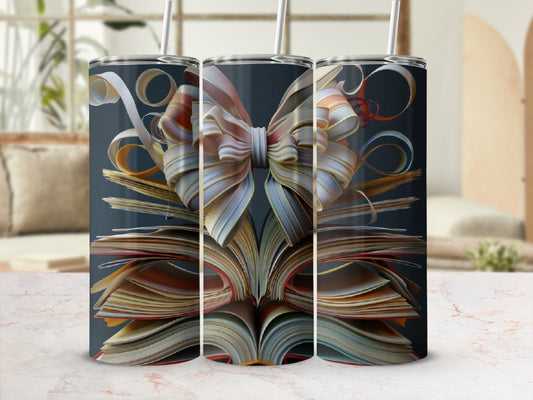 Three open books with ribbon bows on top, on a marble surface.