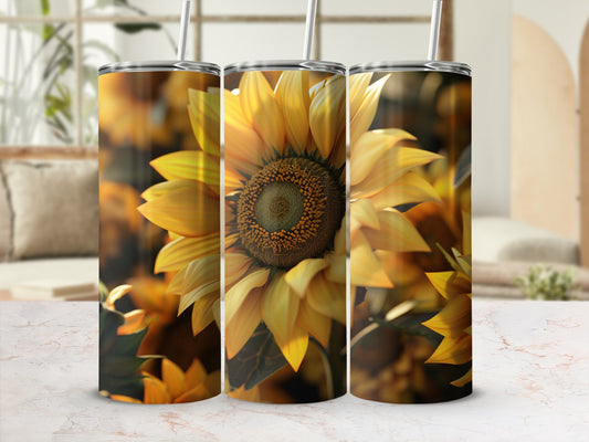 Sunflower pattern tumbler with straw, shown on a marble surface.