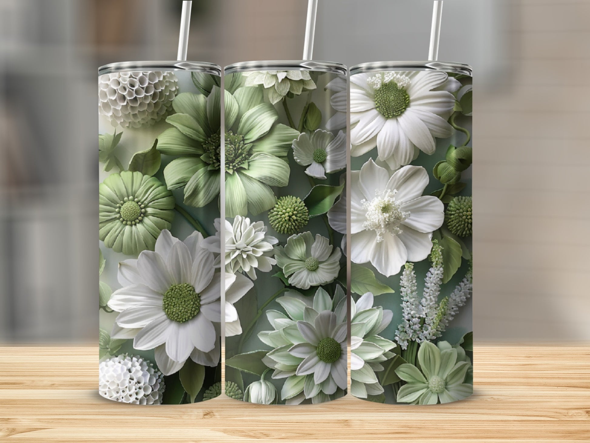 Three tumblers with embossed white and green floral patterns.