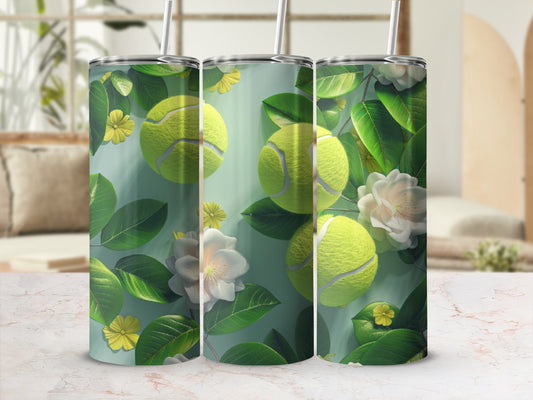 Three tumblers with tennis balls, green leaves, and white flowers.