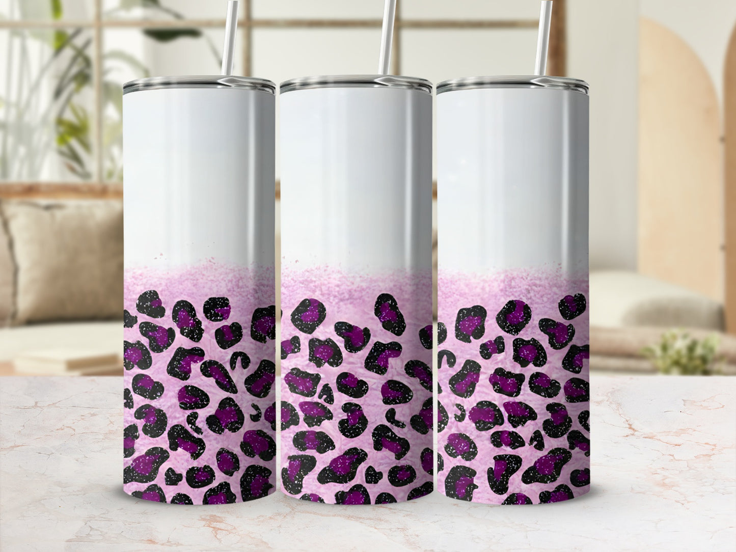 Three tumblers with a purple leopard print design and white tops.